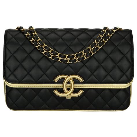 chanel black and gold handbag|Chanel bag with gold ribbon.